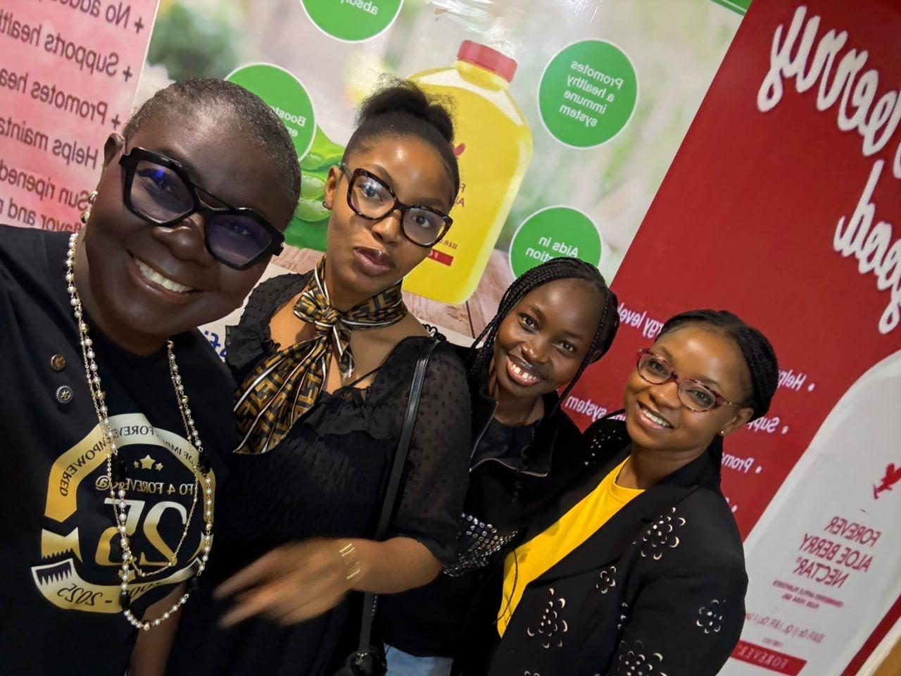 Placeholder image: A collage of four images. 1: A woman smiling on a beach in a tropical location. 2: A new, luxury car with a bow on it. 3: A woman working on a laptop in a beautiful home garden. 4: A group of happy people at a conference or retreat. Style: Bright, aspirational, lifestyle photography.